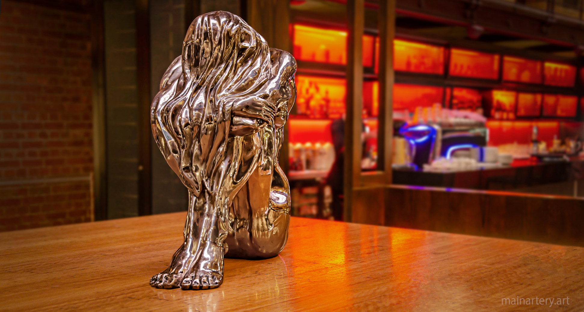 small polished bronze modern hotel sculpture image