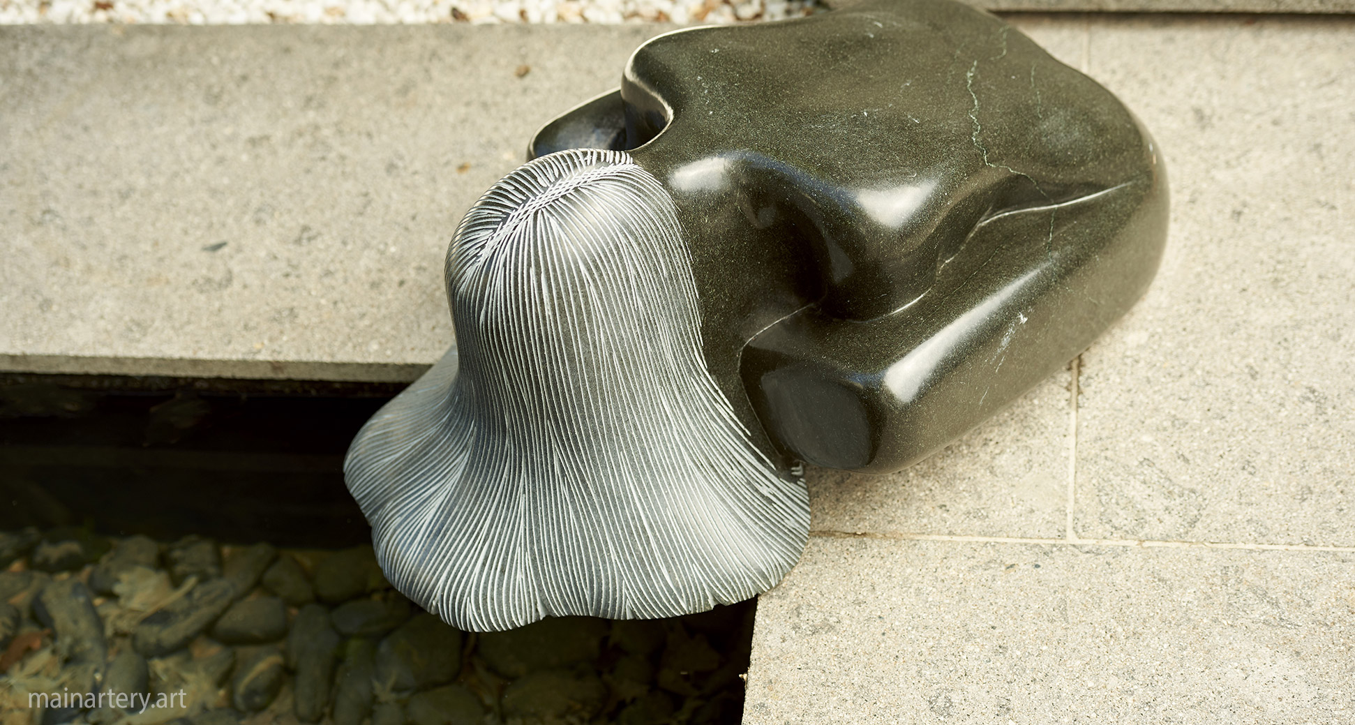 mainartery feminine sculpture art black granite image