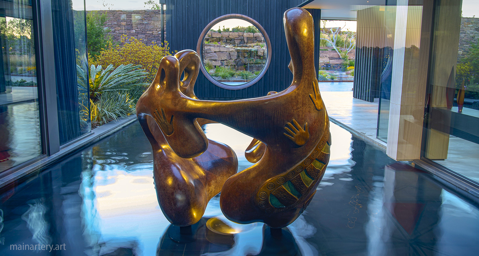 giant multi patina organic outdoor aboriginal family unity sculpture image