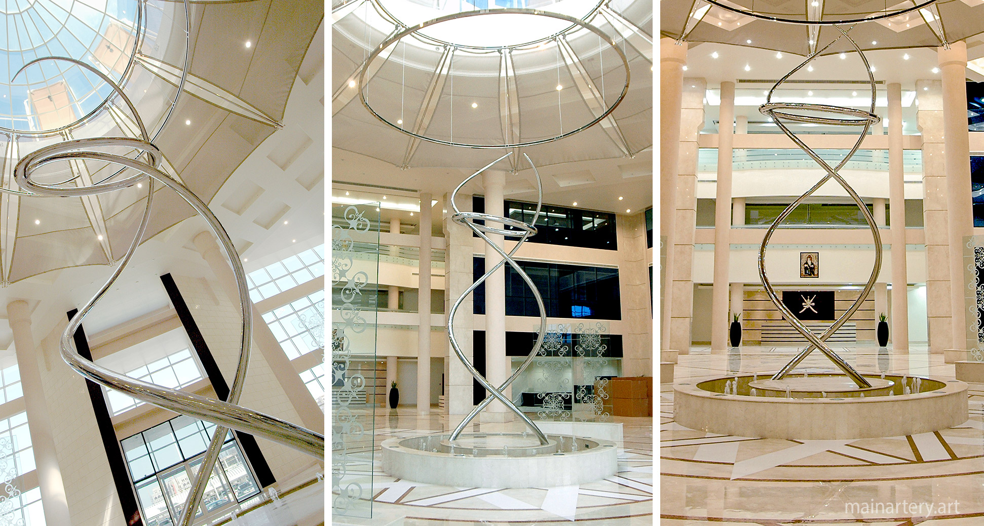 giant mirror polished representational dna totem sculpture image