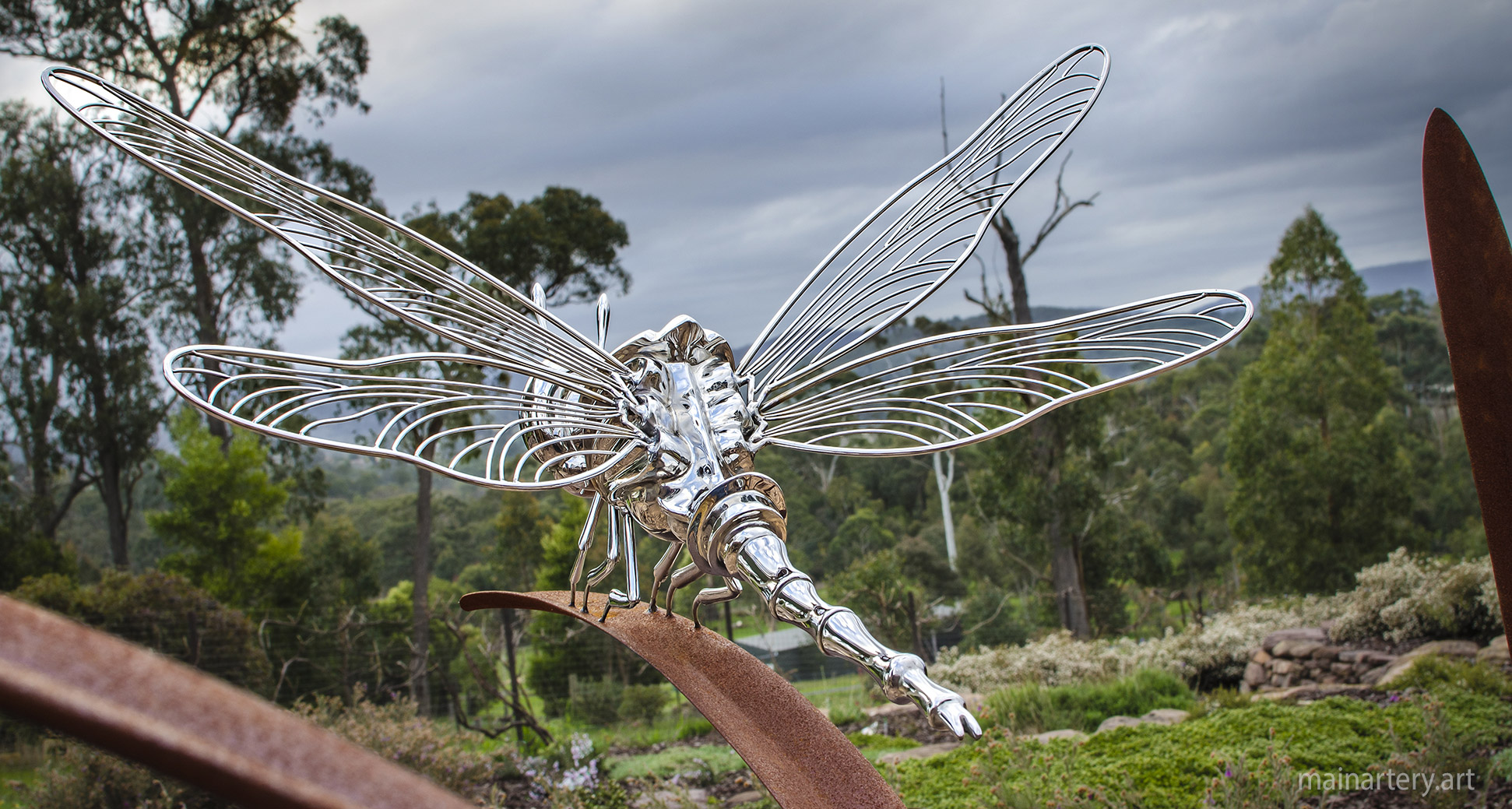 open spaces corten steel dragonfly outdoor artwork image
